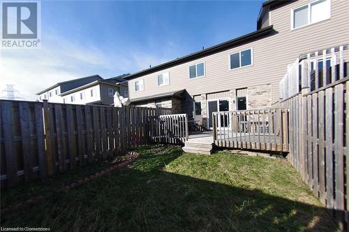 Rear view of house featuring a yard and a deck - 11 Sorrento Street, Kitchener, ON - Outdoor With Exterior