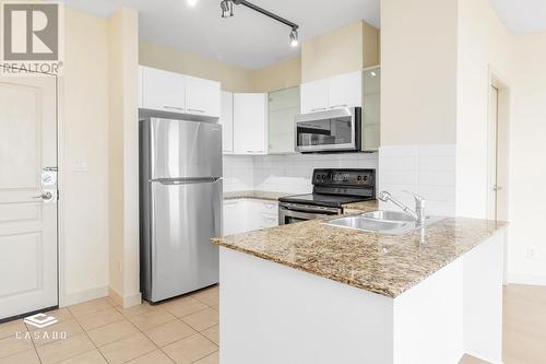 1503 4028 Knight Street, Vancouver, BC - Indoor Photo Showing Kitchen With Stainless Steel Kitchen With Double Sink With Upgraded Kitchen