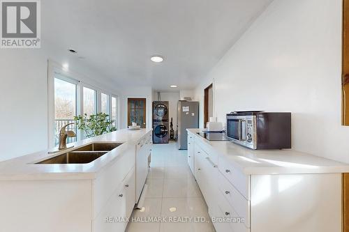 Main - 100 Stevenson Road, Toronto, ON - Indoor Photo Showing Kitchen With Double Sink