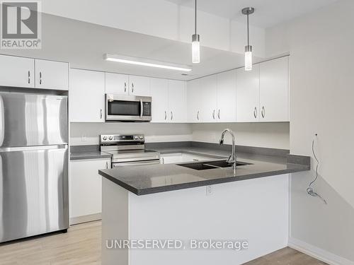 C01 - 350 Fisher Mills Road, Cambridge, ON - Indoor Photo Showing Kitchen With Stainless Steel Kitchen With Double Sink