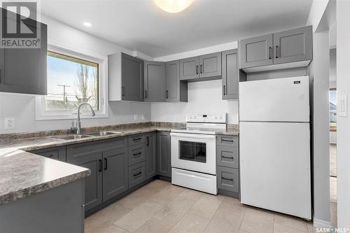 211 3Rd Avenue W, Watrous, SK - Indoor Photo Showing Kitchen With Double Sink