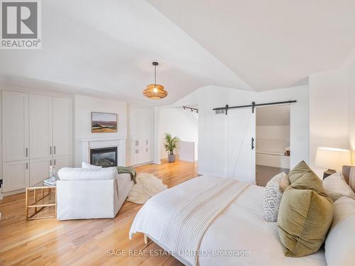 21 Drummondville Lane, Toronto, ON - Indoor Photo Showing Bedroom With Fireplace