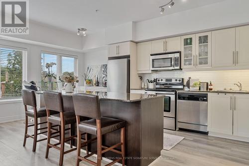 210 - 5 Richgrove Drive, Toronto (Willowridge-Martingrove-Richview), ON - Indoor Photo Showing Kitchen With Stainless Steel Kitchen With Upgraded Kitchen