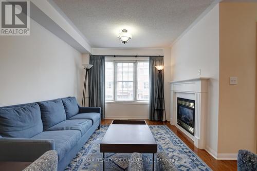 262 - 3030 Breakwater Court, Mississauga, ON - Indoor Photo Showing Living Room With Fireplace