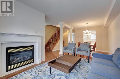 262 - 3030 Breakwater Court, Mississauga, ON - Indoor Photo Showing Living Room With Fireplace