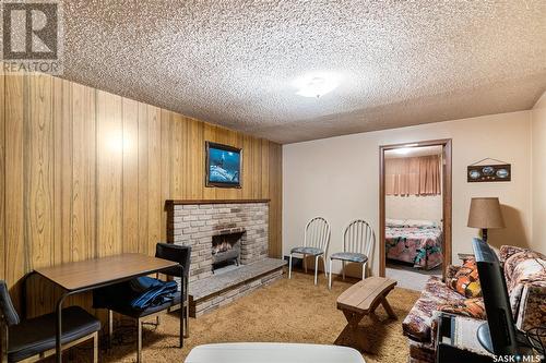 34 O'Neil Crescent, Saskatoon, SK - Indoor Photo Showing Other Room With Fireplace