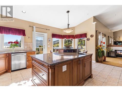 6097 Beatrice Road, Peachland, BC - Indoor Photo Showing Kitchen With Fireplace