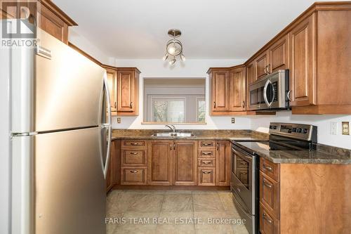 9 Briarwood Drive, New Tecumseth, ON - Indoor Photo Showing Kitchen With Stainless Steel Kitchen With Double Sink