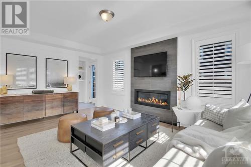 425 Riverboat Heights, Ottawa, ON - Indoor Photo Showing Living Room With Fireplace