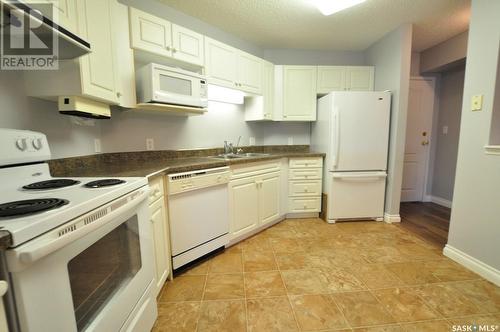 306 57 Russell Drive, Yorkton, SK - Indoor Photo Showing Kitchen With Double Sink