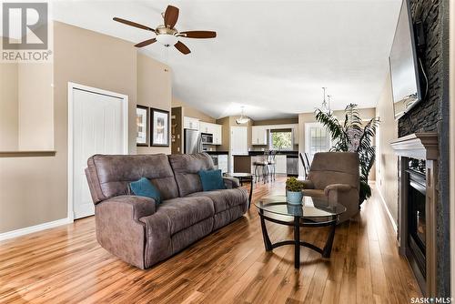 7902 Gordon Staseson Boulevard, Regina, SK - Indoor Photo Showing Living Room With Fireplace