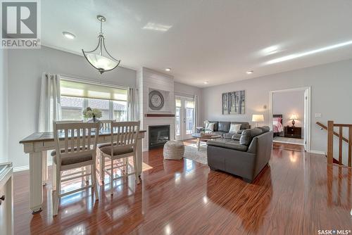 16 1590 4Th Avenue Nw, Moose Jaw, SK - Indoor Photo Showing Living Room With Fireplace