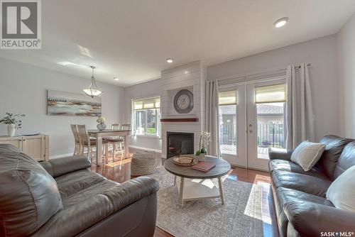 16 1590 4Th Avenue Nw, Moose Jaw, SK - Indoor Photo Showing Living Room With Fireplace