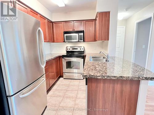 201 - 4889 Kimbermount Avenue, Mississauga, ON - Indoor Photo Showing Kitchen With Stainless Steel Kitchen With Double Sink With Upgraded Kitchen