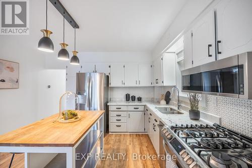 10 Innes Avenue, Toronto, ON - Indoor Photo Showing Kitchen With Double Sink