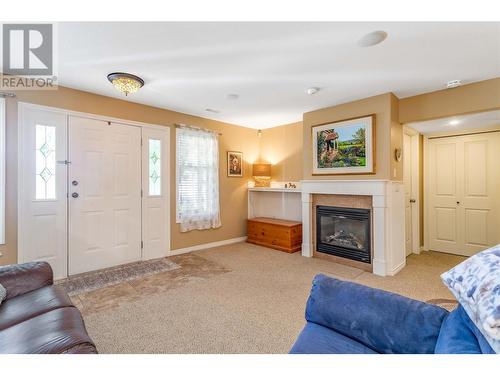 389 Mccarren Avenue, Kelowna, BC - Indoor Photo Showing Living Room With Fireplace