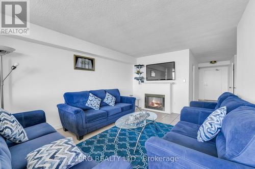 2209 - 3300 Don Mills Road, Toronto (Don Valley Village), ON - Indoor Photo Showing Living Room With Fireplace