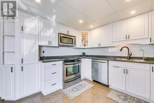 709 - 5090 Pinedale Avenue, Burlington, ON - Indoor Photo Showing Kitchen With Double Sink