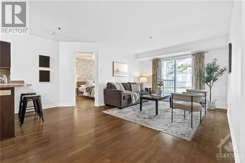 Freshly painted main living area offers a bright and modern living space - 151 Potts Private Unit#107, Ottawa, ON - Indoor Photo Showing Living Room