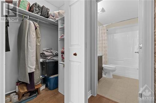 Primary bedroom with walk in closet and ensuite - 151 Potts Private Unit#107, Ottawa, ON - Indoor Photo Showing Bathroom