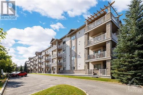 This unit comes with 1 underground parking spot and building  offers designated visitor parking spaces - 151 Potts Private Unit#107, Ottawa, ON - Outdoor With Balcony With Facade