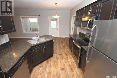 204 3818 Dewdney Avenue E, Regina, SK - Indoor Photo Showing Kitchen With Stainless Steel Kitchen With Double Sink