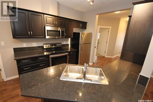 204 3818 Dewdney Avenue E, Regina, SK - Indoor Photo Showing Kitchen With Stainless Steel Kitchen With Double Sink