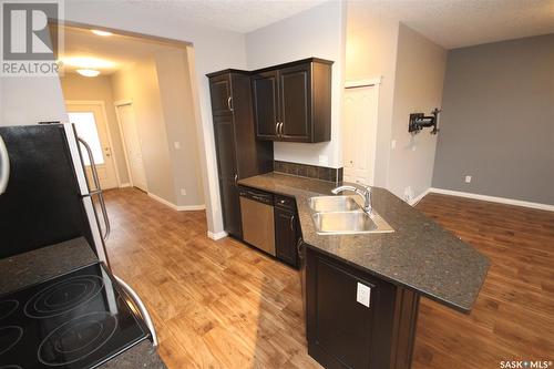 204 3818 Dewdney Avenue E, Regina, SK - Indoor Photo Showing Kitchen With Double Sink