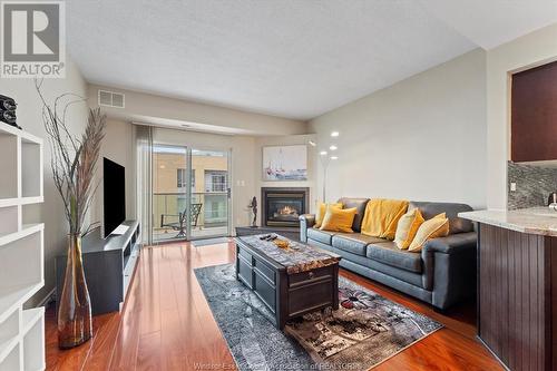 4789 Riverside Drive Unit# 1206, Windsor, ON - Indoor Photo Showing Living Room With Fireplace