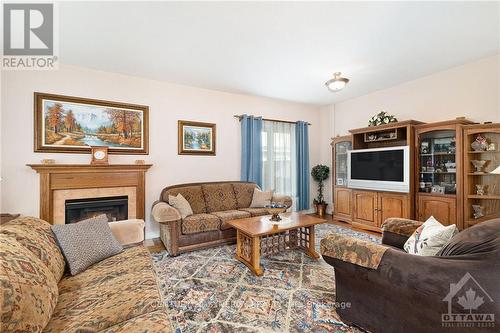 235 Station Boulevard, Ottawa, ON - Indoor Photo Showing Living Room With Fireplace