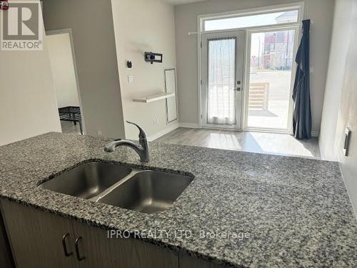 104 - 200 Lagerfeld Drive, Brampton, ON - Indoor Photo Showing Kitchen With Double Sink