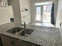 104 - 200 Lagerfeld Drive, Brampton, ON  - Indoor Photo Showing Kitchen With Double Sink 