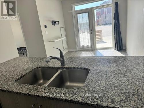 104 - 200 Lagerfeld Drive, Brampton, ON - Indoor Photo Showing Kitchen With Double Sink