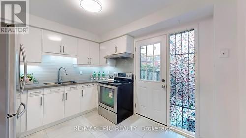 100 - 275 Broadview Avenue, Toronto, ON - Indoor Photo Showing Kitchen With Double Sink