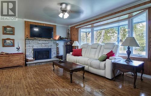 6 Kawartha Crescent, Kawartha Lakes, ON - Indoor Photo Showing Living Room With Fireplace