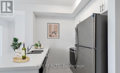 405 - 450 Dundas Street E, Hamilton (Waterdown), ON - Indoor Photo Showing Kitchen With Double Sink