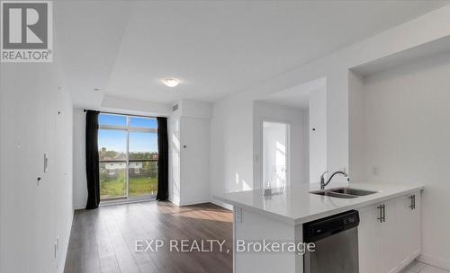 405 - 450 Dundas Street E, Hamilton (Waterdown), ON - Indoor Photo Showing Kitchen With Double Sink