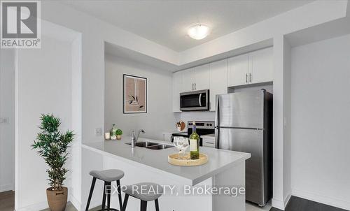 405 - 450 Dundas Street E, Hamilton (Waterdown), ON - Indoor Photo Showing Kitchen With Double Sink