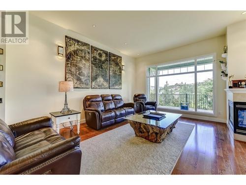 2168 Chilcotin Crescent, Kelowna, BC - Indoor Photo Showing Living Room With Fireplace