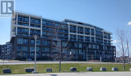 422 - 60 George Butchart Drive, Toronto, ON - Outdoor With Balcony With Facade