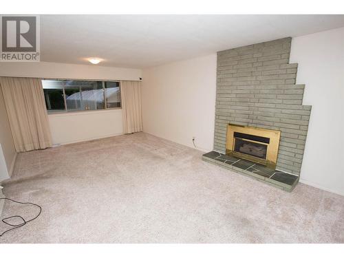 2660 1St Avenue, Prince George, BC - Indoor Photo Showing Living Room With Fireplace