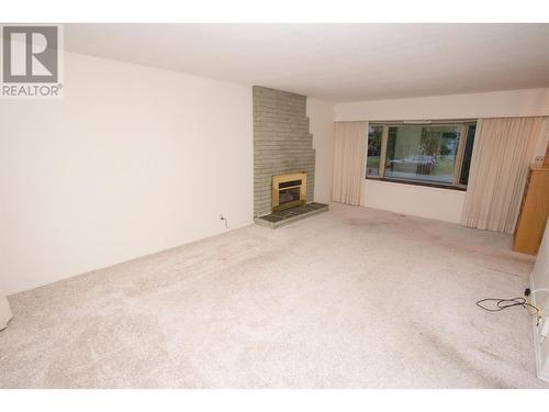 2660 1St Avenue, Prince George, BC - Indoor Photo Showing Living Room With Fireplace