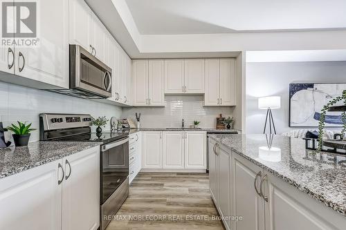 B602 - 5279 Highway  7 Road, Vaughan (Vaughan Grove), ON - Indoor Photo Showing Kitchen With Upgraded Kitchen