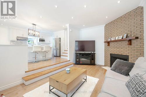 31 Guthrie Crescent, Whitby, ON - Indoor Photo Showing Living Room With Fireplace