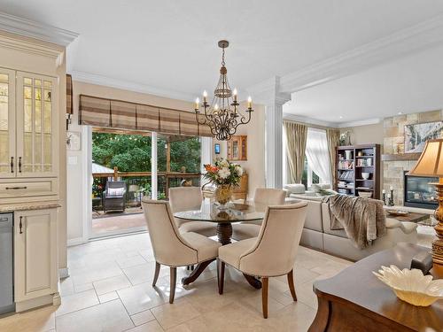 Coin-repas - 17065 Rue Du Grenat, Mirabel, QC - Indoor Photo Showing Dining Room With Fireplace