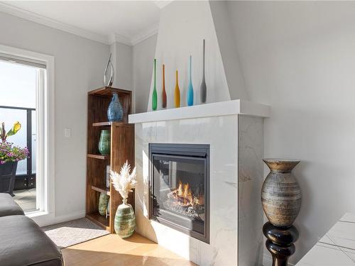 Ph403-2409 Bevan Ave, Sidney, BC - Indoor Photo Showing Living Room With Fireplace