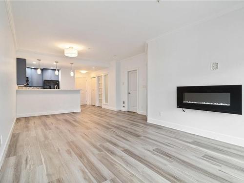 205-2881 Peatt Rd, Langford, BC - Indoor Photo Showing Living Room With Fireplace