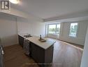 1001 - 160 Densmore Road, Cobourg, ON  - Indoor Photo Showing Kitchen With Double Sink 