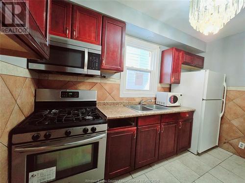 1111 Lillian Avenue, Windsor, ON - Indoor Photo Showing Kitchen With Double Sink