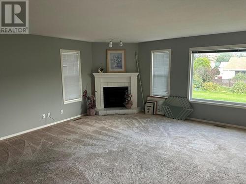 211 2Nd Street, Vernon, BC - Indoor Photo Showing Living Room With Fireplace